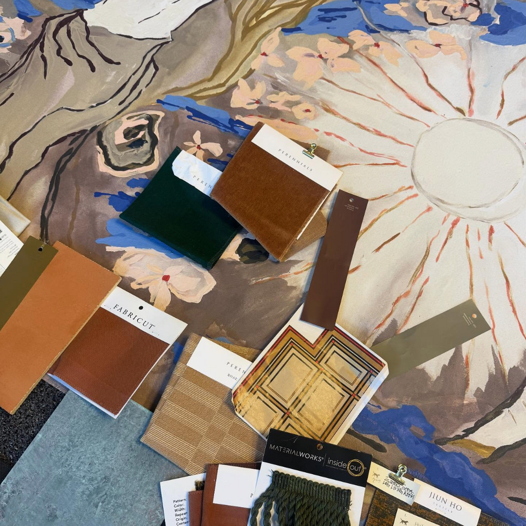 Color swatches and fabric samples on a painted canvas surface